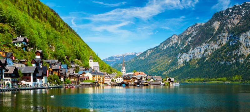 View across a lake of a small town in Austria.